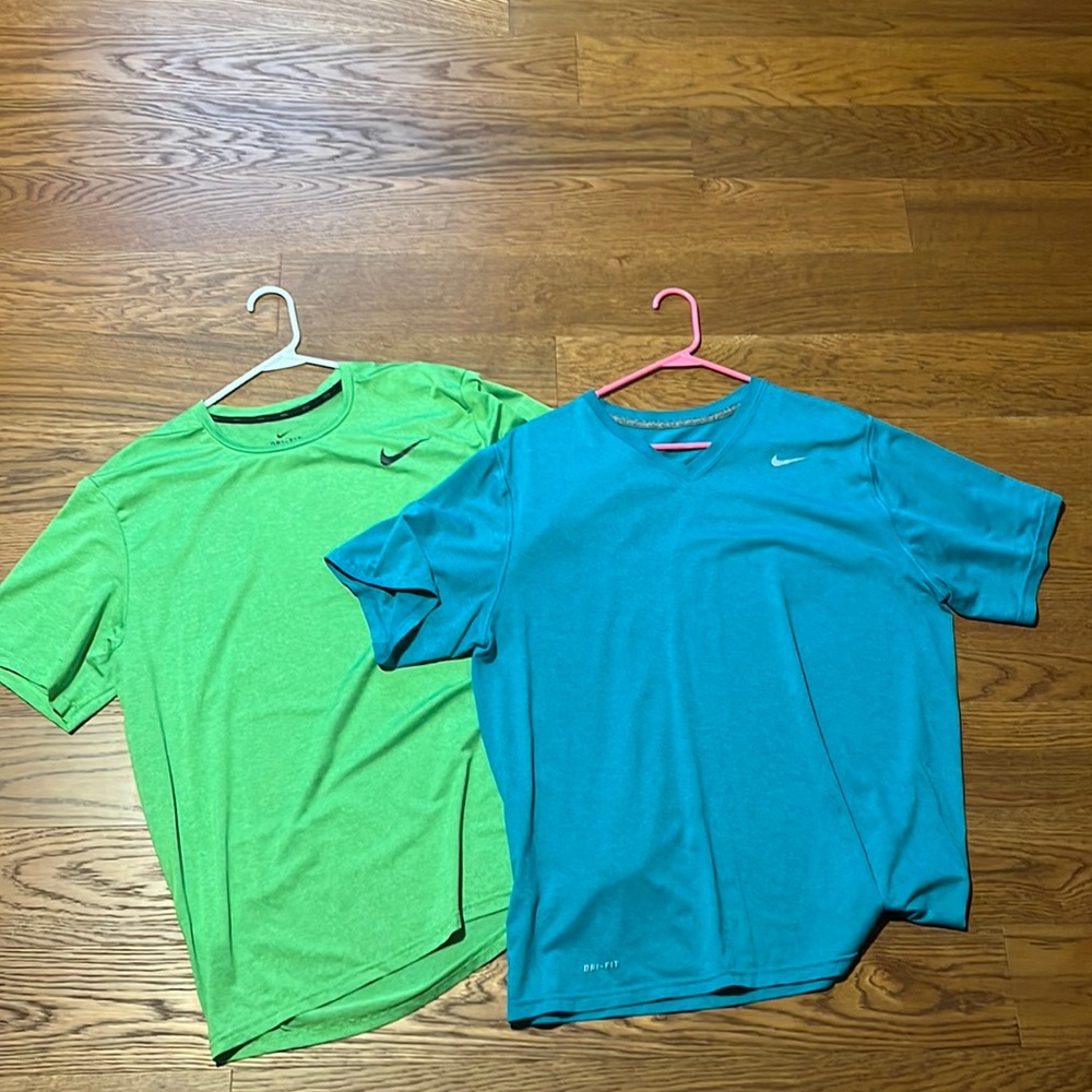 2 nike dri fit tees, green is a scoop neck and blue is a v neck.